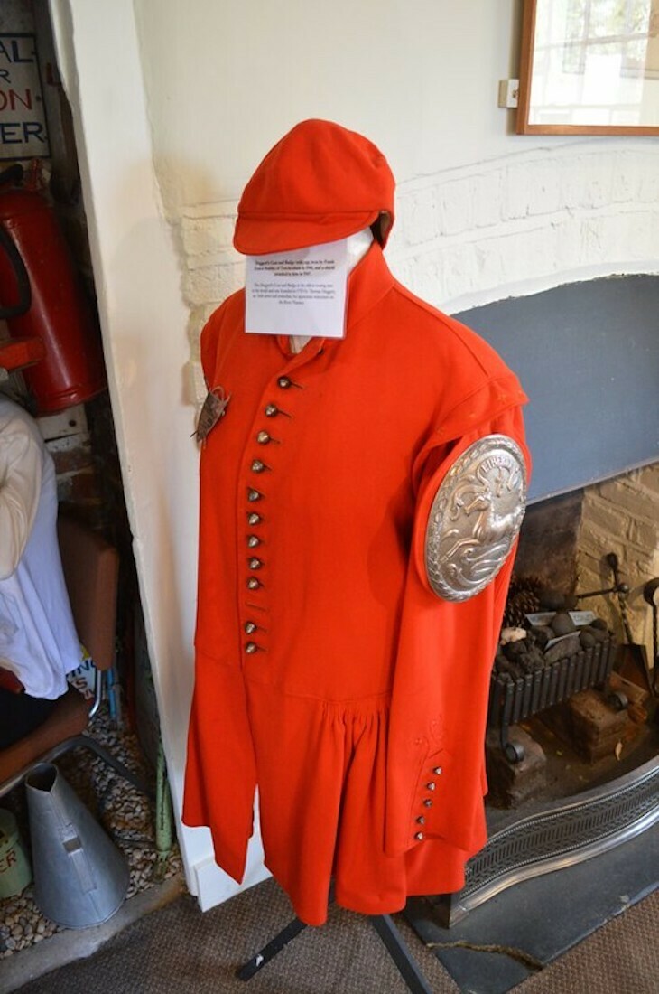 A bright red coat with silver badge in twickenham museum