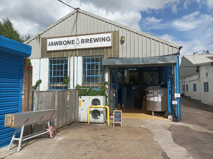 A large industrial shed with Jawbone Brewing on a sign