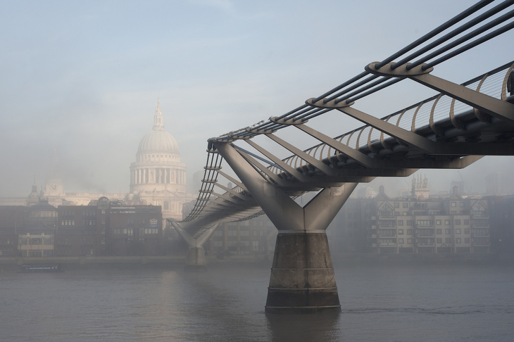 The Millennium Bridge in the misty, with St Paul's enveloped in the background