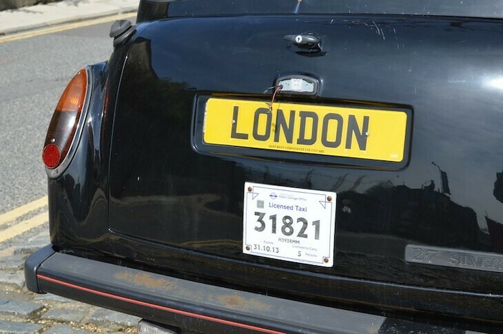 Back of a black cab with number plate saying London