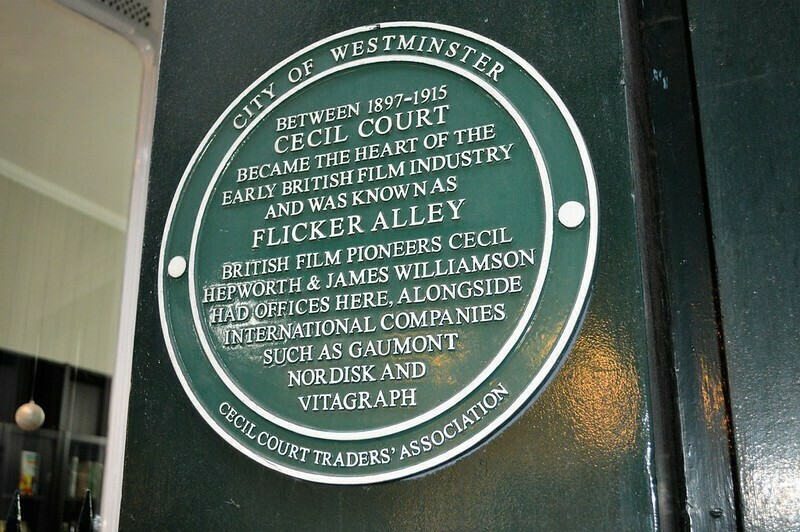 A green plaque to Flicker Alley otherwise known as Cecil Court