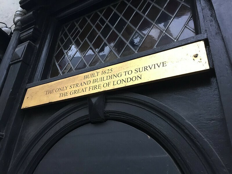 A plaque on a strand building declaring its vintage from before the great fire