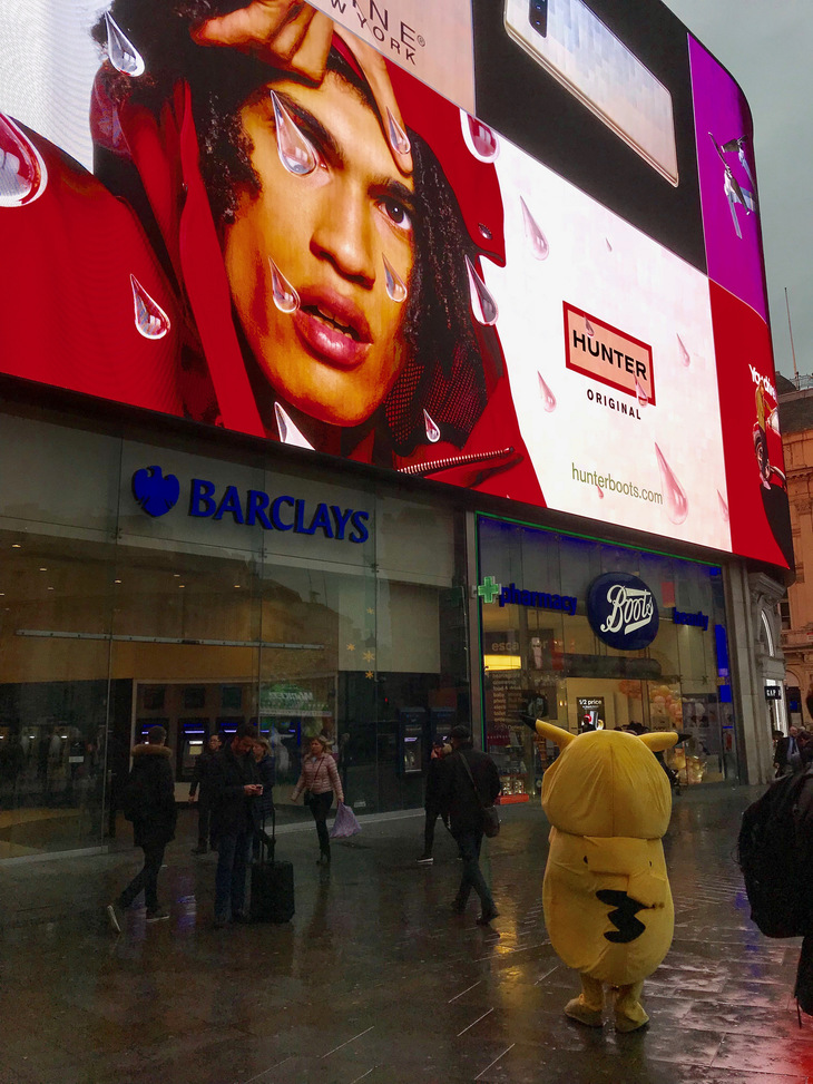 A wet Pikachu in Piccadilly Circus