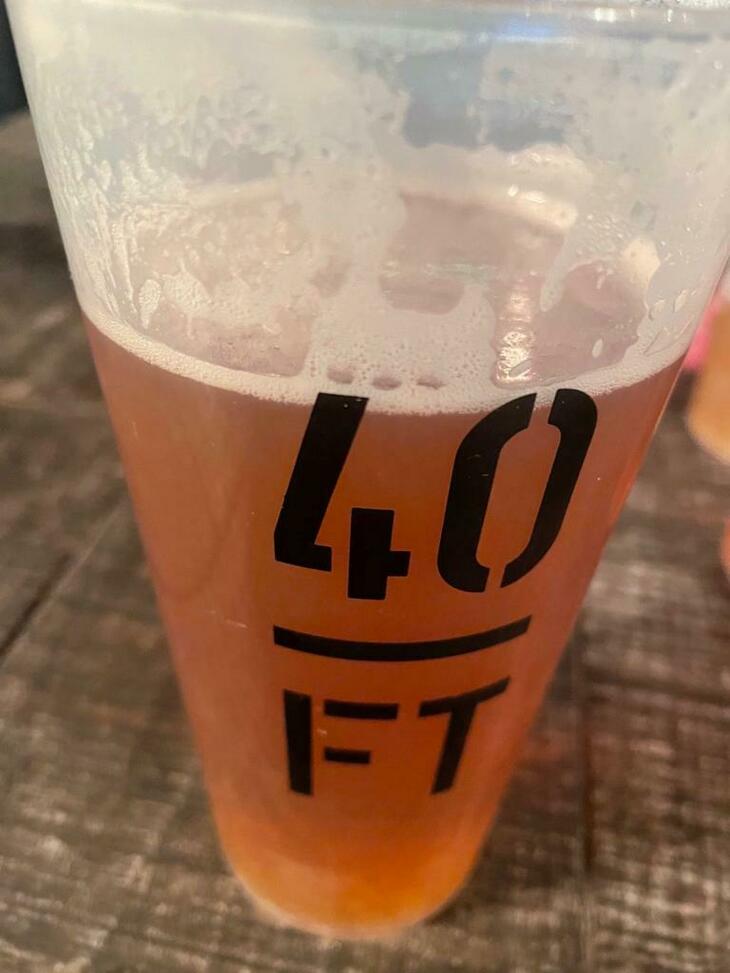 Brewery taprooms in London: Close up of a beer in a branded 40FT glass