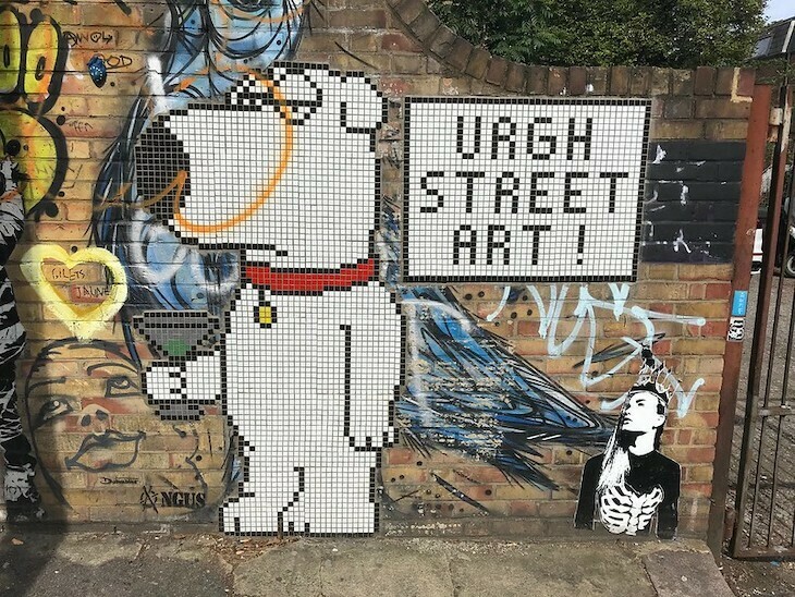 A bit of street art showing Brian from family guy next to a sign saying Urgh Street Art