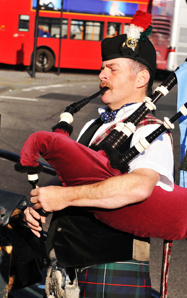 A bagpiper in Trafalgar Square