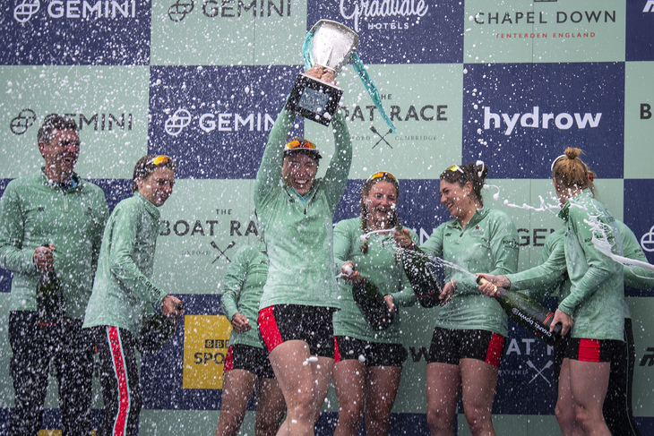 A winning team spraying each other with champagne