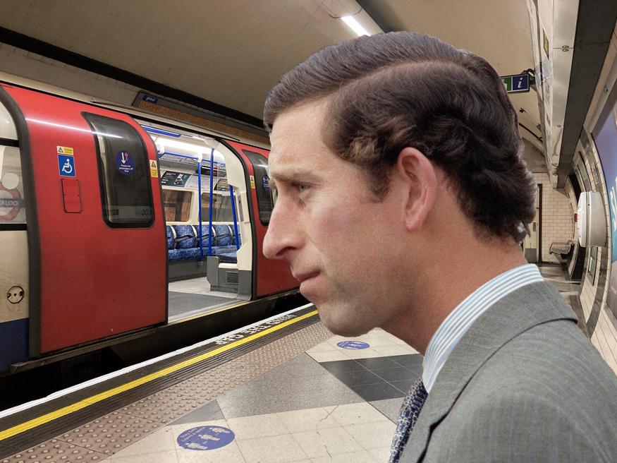 A younger Prince Charles appears to be standing on a tube platform looking at carriages