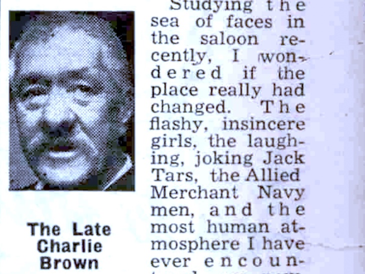 A clipping from a newspaper showing a moustachioed man, identified as Charlie Brown