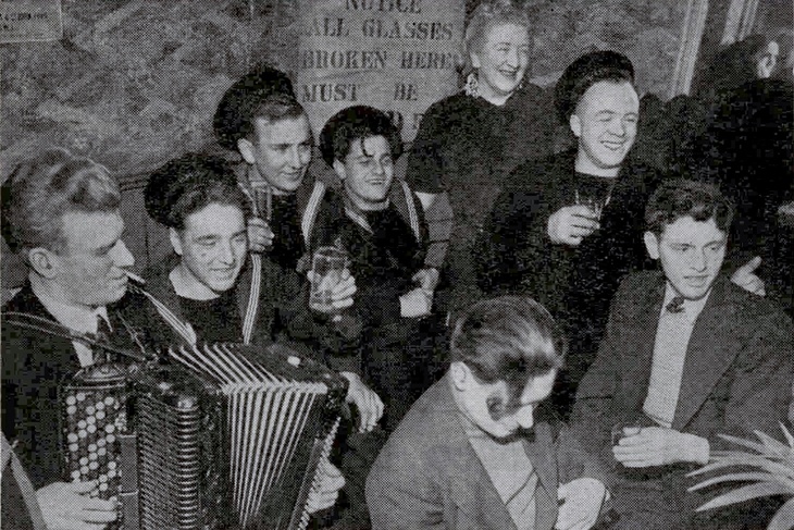 A group of sailors enjoying a pint
