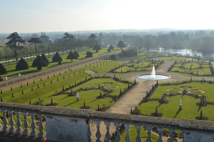 Coronation events in London: a view over the formal gardens of Hampton Court Palace, taken from the palace building. It includes symmetrical lawns and pathways, and a fountain.