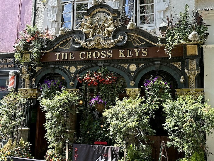 The Cross Keys in Covent Garden is largely obscured by foliage