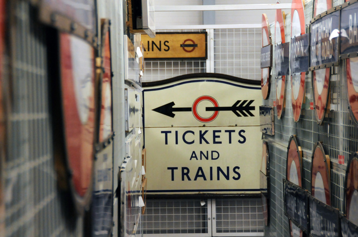 A vintage tube sign: 'tickets and trains' - with an arrow