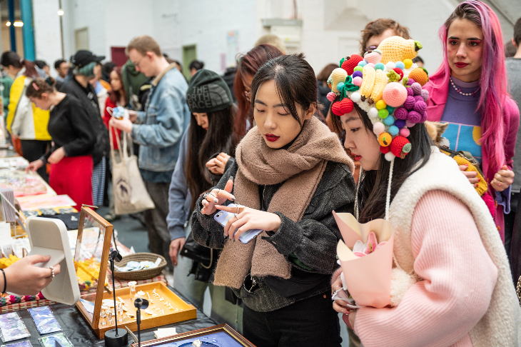 People browsing stalls at the DIY Art Market