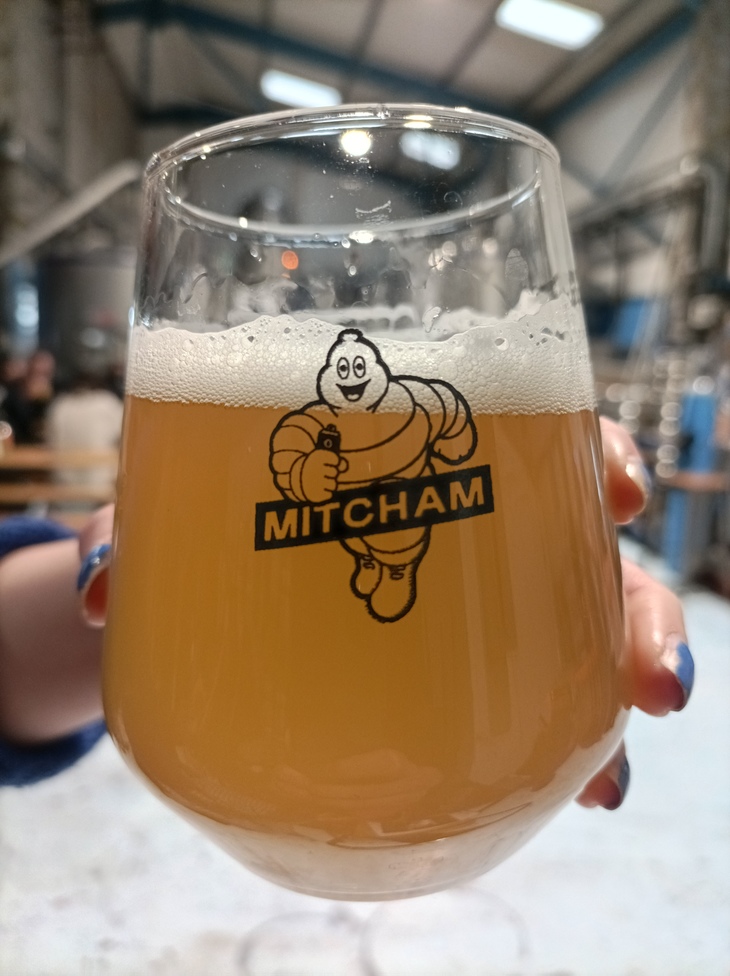 Brewery taprooms in London: A glass of IPA with a 'Mitcham' Michelin Man on it