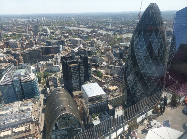 A sky high view of London, looking down on the Gherkin