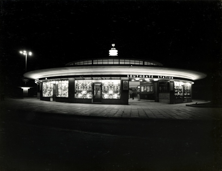 A black and shite picture of the station illuminated at night