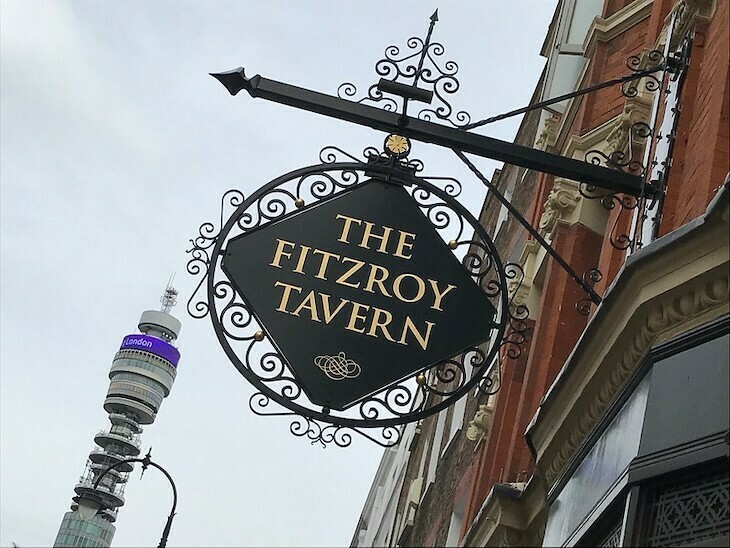Hanging sign of the Fitzroy Tavern with BT Tower in background