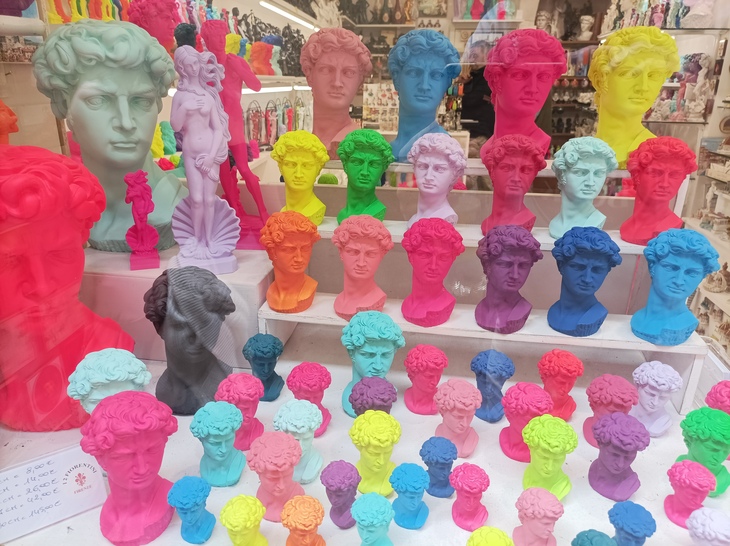 A winw full of luminous busts of David