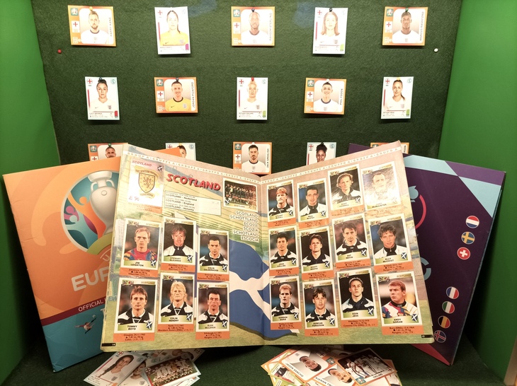 A football sticker album showing England and Scotland players