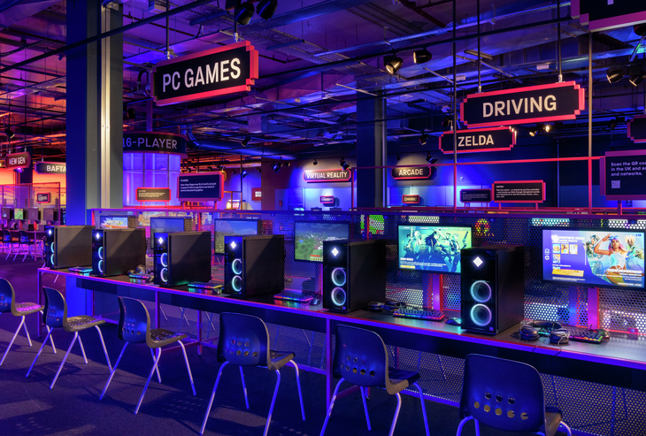 Play arcade games in London: a row of gaming computers next to speakers