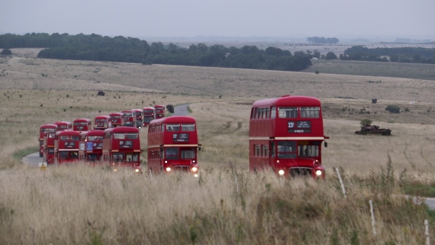 Imberbus 2023: a line of Routemasters driving across the countryside
