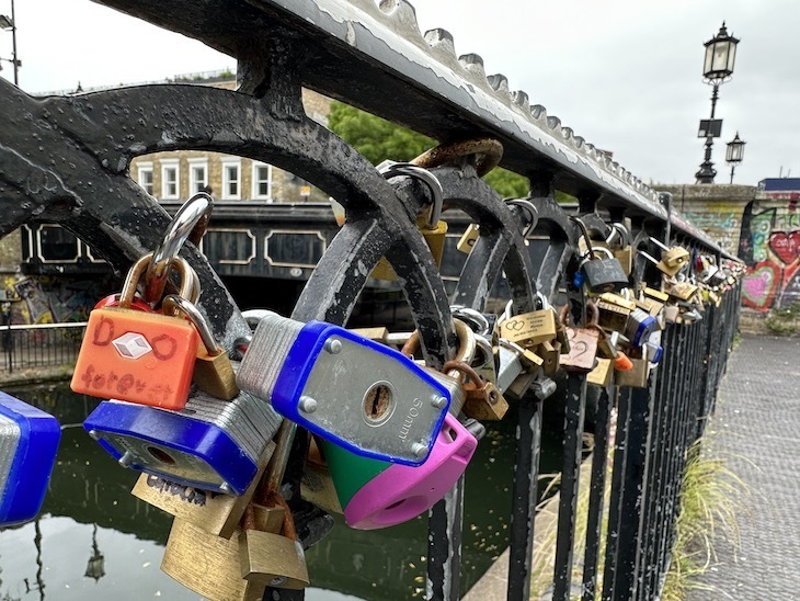 Loads and loads of padlocks, clamped onto the metalwork of Camden Lock canal