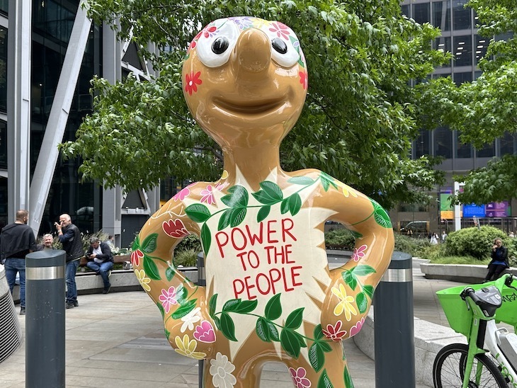 A morph statue with Power to the People on its chest