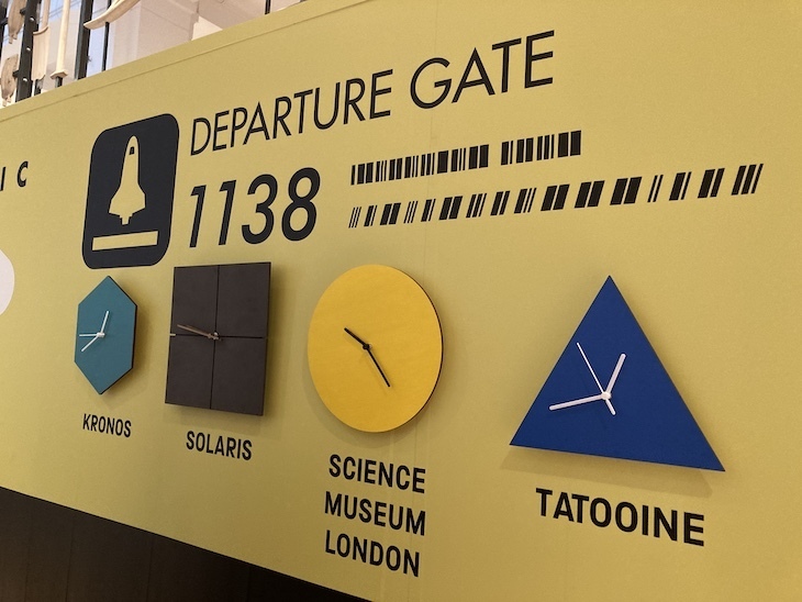 Four clocks show the time in three sci-fi realms and the science museum