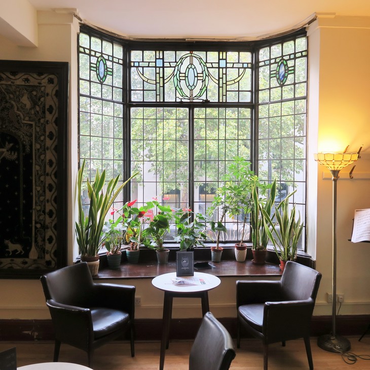 A beautiful bay window with lots of house plants in it