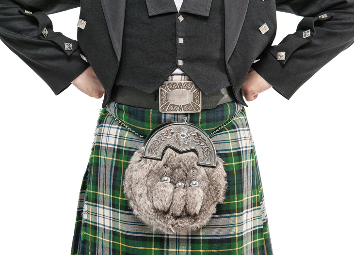 A green tartan kilt and sporran - worn by someone with their hands on their hips