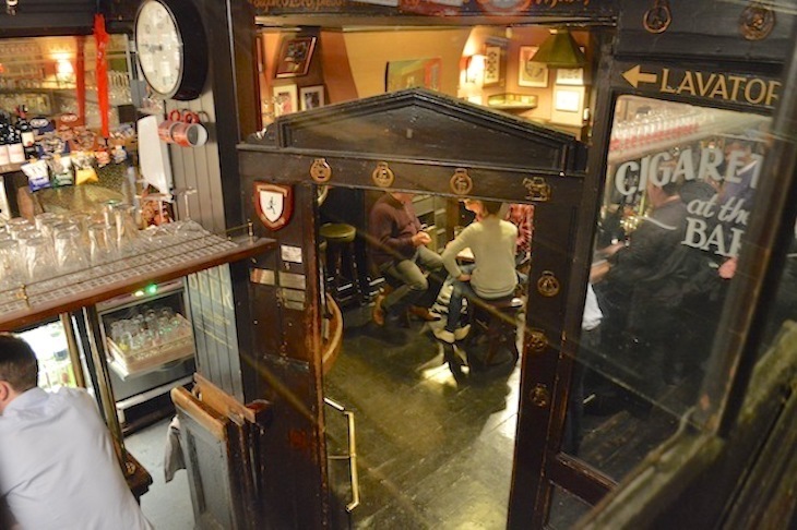 Inside the Lamb and Flag in Covent Garden, looking down at the bar from the stairs