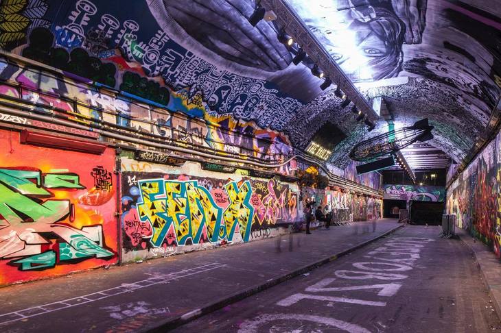 Free Things To Do In London: a tunnel bright with various graffiti artworks