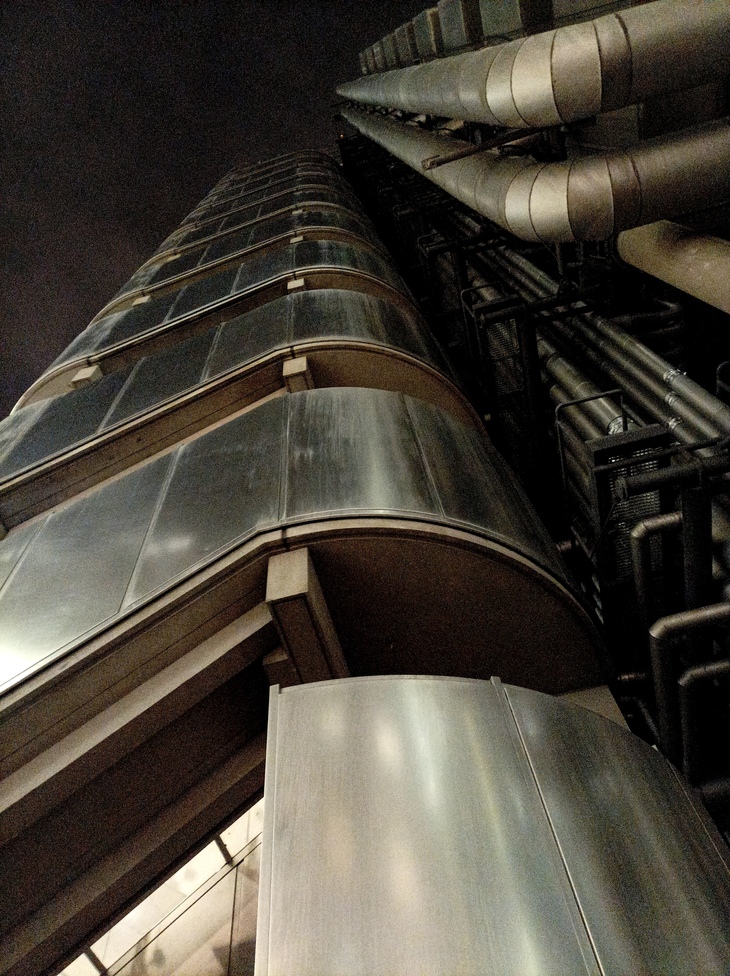 Looking up at the sci fi metal exterior of the Llloyd's building