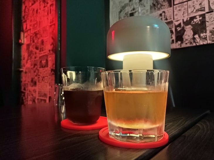 Things to do in Birmingham: Two cocktails beneath a table lamp