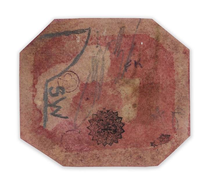 the back of an eight-sided stamp - coloured light red, and with signatures on it