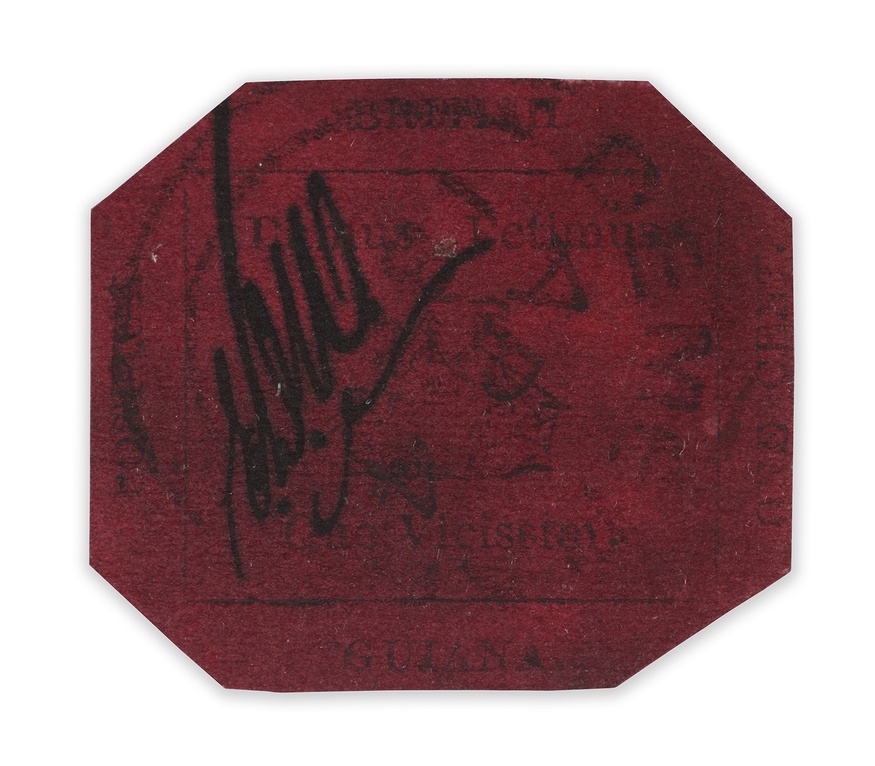 A vermillion coloured eight sided stamp
