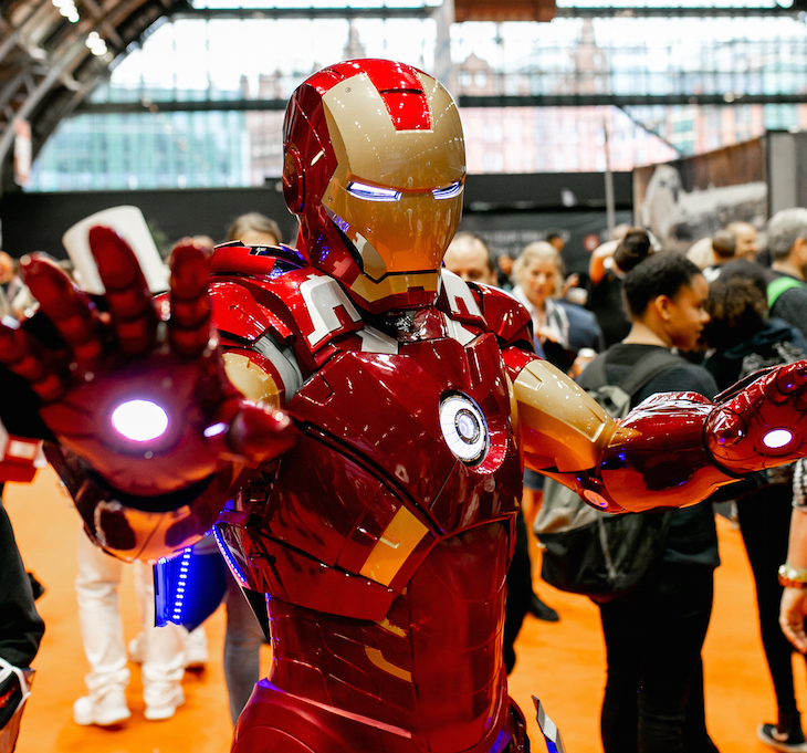 Someone in an Ironman costume poses for a photo