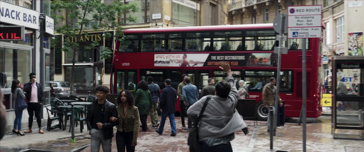 A London street scene with double decker bus and lots of people