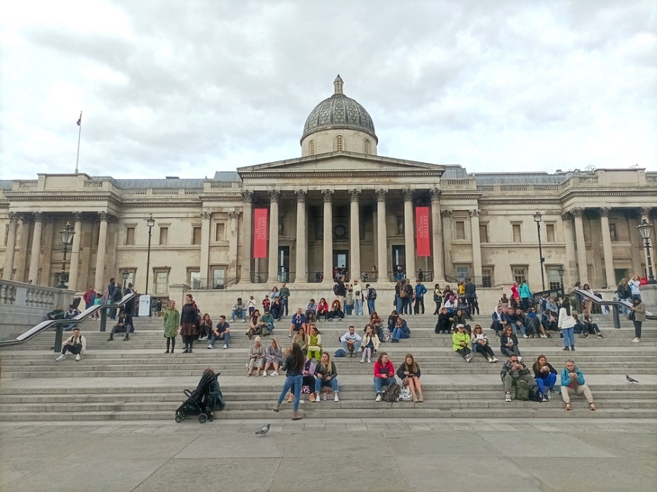 People sat on the steps outside the National Gallery