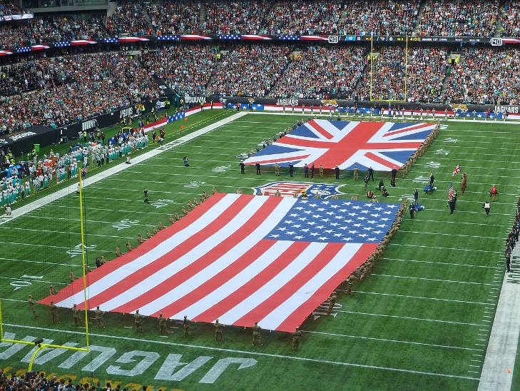 NFL in London: Huge American and Union Jack flags on the pitch at Tottenham Hotspur before an NFL match begins.