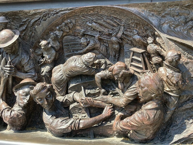 A bronze relief sculpture of the Plessey aircraft factory in the central line tunnels