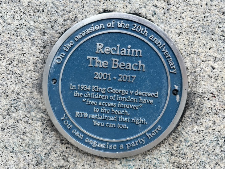 A reclaim the beach plaque