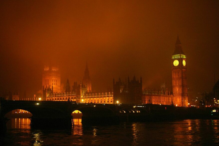 The Houses of Parliament shrouded in an orangy mist