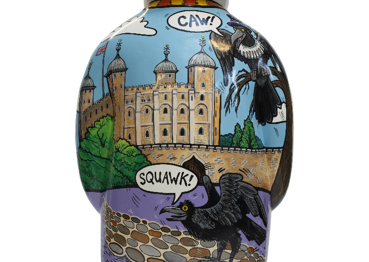 The back of a The Snowman sculpture, with a painting of the Tower of  London and its ravens.