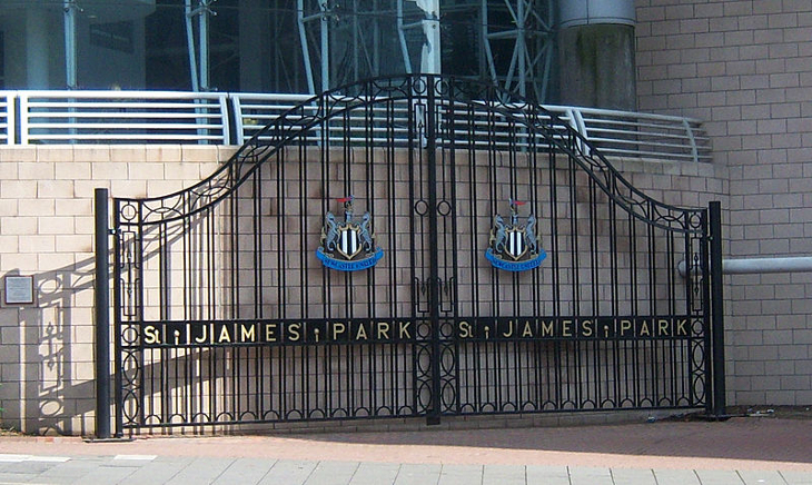 The black metal gates outside the stadium, bearing the Newcastle United emblem, and with 'St James Park' written across them