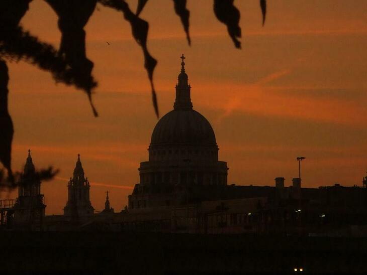 St Paul's Cathedral silhouetted against a rich sunset