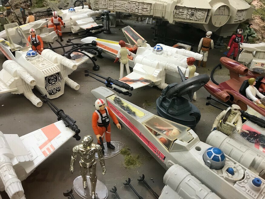 A collection of Star Wars toys on a table