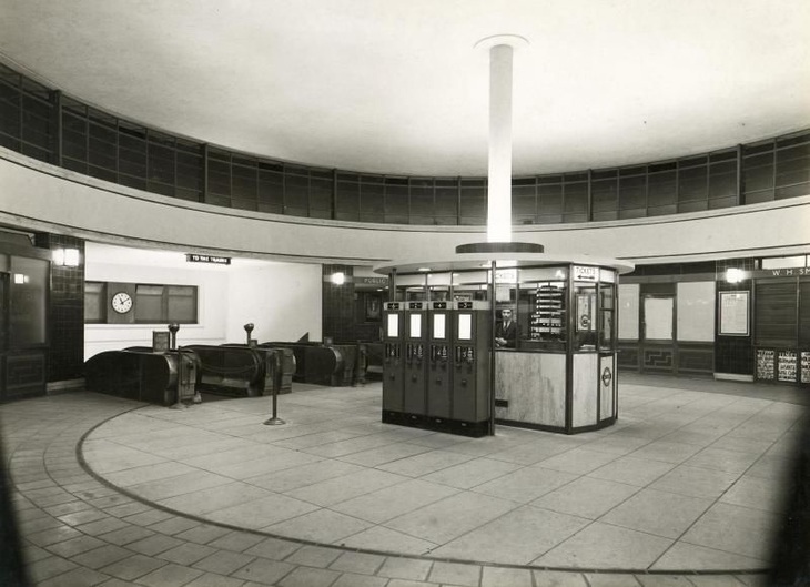 Black and white image of the ticket hall with its passimeters