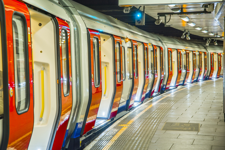 A tube train at the platform with all of its doors open